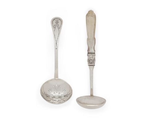 A 1920s silver sifting spoon. Liberty & Co. Birmingham, 1928. The engraved and lightly planished handle to a pierced bowl, 13