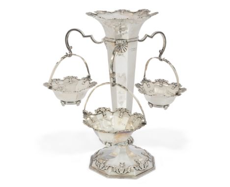 An Edwardian silver epergne with three hanging baskets. William Comyns & Sons, London, 1906. The trumpet-shaped central vase 