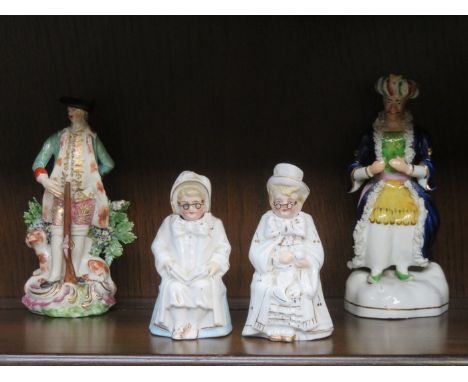 STAFFORDSHIRE SEATED FIGURE, CONTINENTAL FIGURE AND TWO NODDING FIGURES 