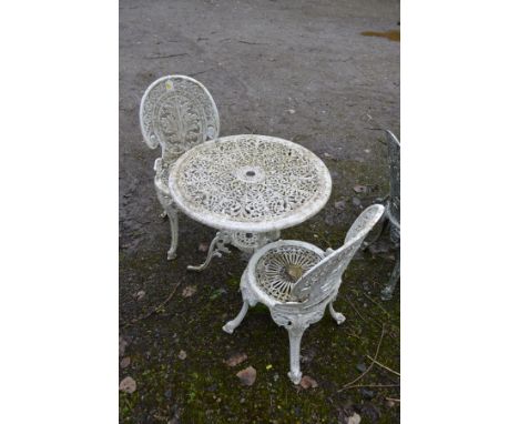 A CIRCULAR WHITE GROUND ALUMINIUM GARDEN TABLE, diameter 69cm x height 69cm and two matching chairs (3)