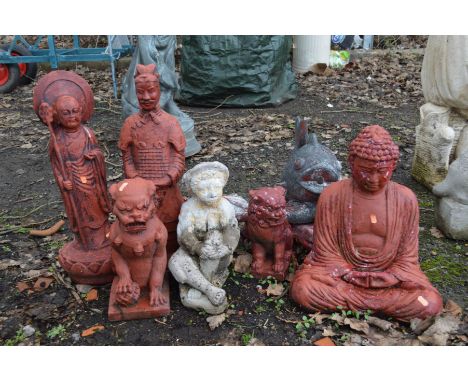 A COLLECTION OF COMPOSITE RED GROUND ORIENTAL GARDEN FIGURES, to include a Buddha, two dogs of fo, standing male figures, fis