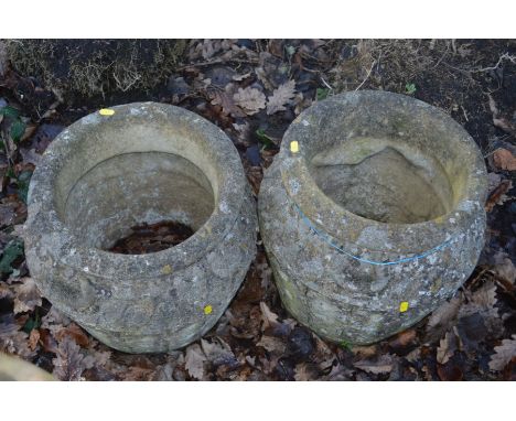 A PAIR OF CIRCULAR COMPOSITE GARDEN PLANTERS, with spandrels decoration