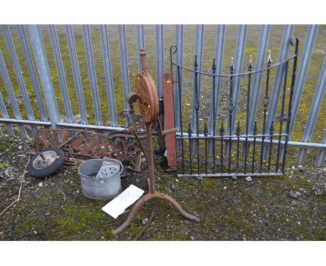 A BLACK GROUND WROUGHT IRON SINGLE GARDEN GATE, width 90cm x height 109cm, together with a pair of wrought iron bench ends an