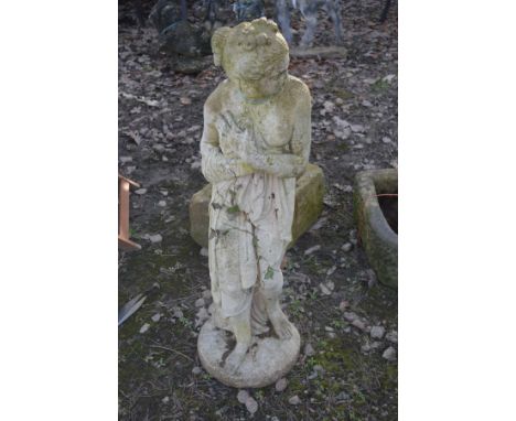 A COMPOSITE GARDEN FIGURE OF A STANDING SEMI CLAD WOMAN, height 117cm