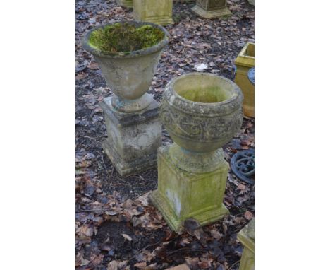 A COMPOSITE CYLINDRICAL TAPERING GARDEN PLANTER, diameter 50cm x height 40cm, on a separate non matching base, overall height