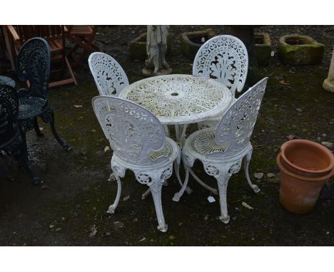 A CIRCULAR WHITE GROUND ALUMINIUM GARDEN TABLE, diameter 68cm and four matching chairs (5)