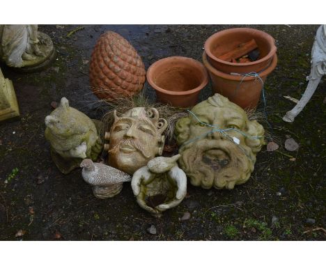 TWO SIMILAR COMPOSITE GROTESQUE WALL MOUNTED PLANTERS, together with three terracotta plant pots, acorn finial and three vari