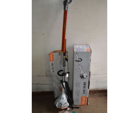 A STIHL KM 56 R PETROL COMBI ENGINE, with hi-km long reach hedge trimmer (original boxes, blade cover, accessory key and inst
