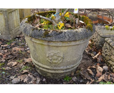 A CIRCULAR COMPOSITE GARDEN PLANTER, diameter 56cm x height 45cm