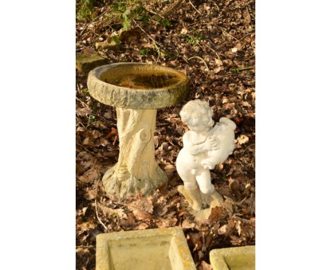 A COMPOSITE TREE STUMP BIRD BATH, height 56cm, together with garden figure of a putto holding an urn (2)