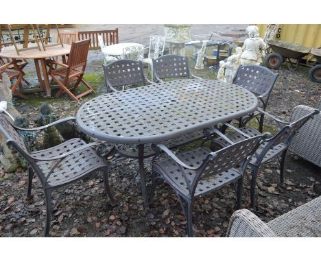 A WROUGHT IRON LATTICE GARDEN TABLE, with rounded corners and undershelf, width 183cm x depth 110cm, together with six matchi