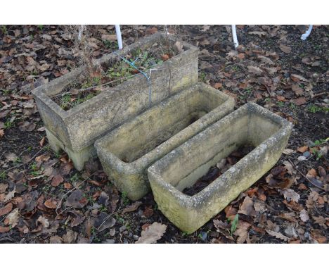 A COMPOSITE RECTANGULAR GARDEN PLANTER, on separate feet, width 72cm x depth 27cm, together with a pair of similar rectangula