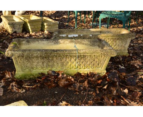 A PAIR OF RECTANGULAR COMPOSITE GARDEN PLANTERS, with scrolled ends and spandrel decoration, width 90cm x depth 34cm