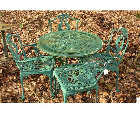 A GREEN GROUND CIRCULAR ALUMINIUM GARDEN TABLE, diameter 80cm x height 69cm and four chairs including two carvers and an umbr