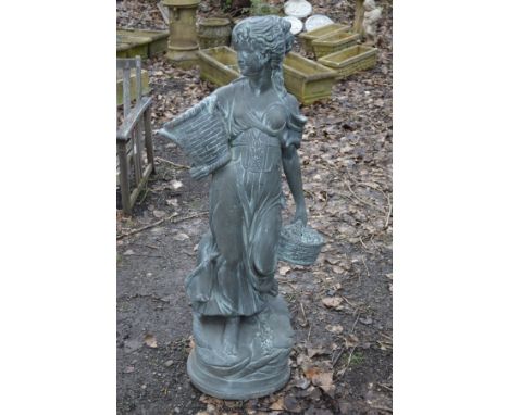 A COMPOSITE STANDING GARDEN FIGURE OF A WOMAN, carrying two baskets, height 136cm