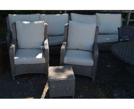 AN LG OUTDOOR RATTAN FIVE PIECE GARDEN SET, comprising two x two seater settees, a pair of armchairs and an occasional table 