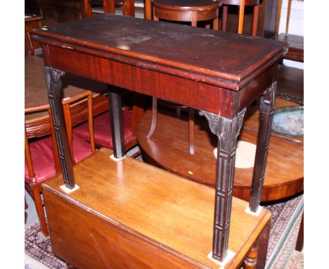 A late Georgian Irish mahogany fold-over top card table, with Gothic blind fret carving and chamfered supports, 33 1/2" wideC