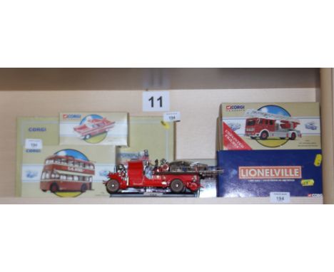 An assortment of boxed limited edition die-cast scale models, including American Ladder Truck, Orlando 