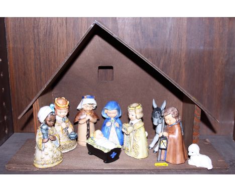 A Hummel nativity set, complete with wooden stable 