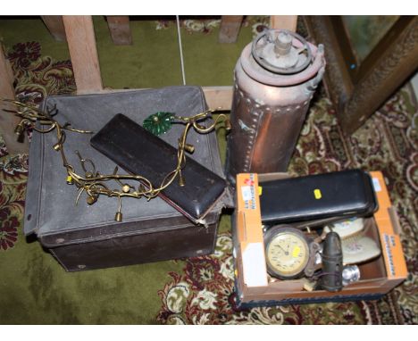 A collection of metalware and other items, including a copper fire extinguisher, a typewriter, cased flatware, dressing table