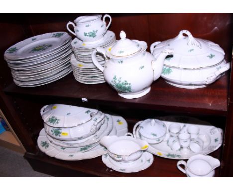 An extensive Rosenthal combination service, decorated with green floral sprays on a white ground 