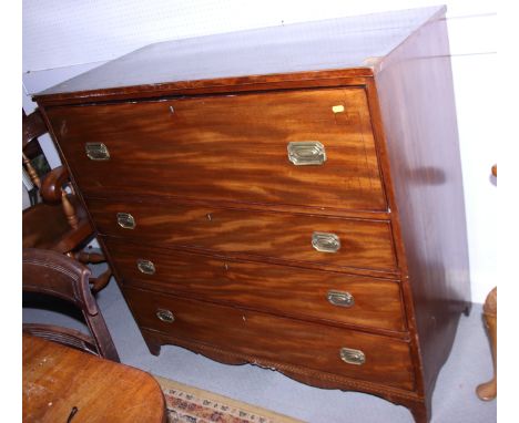 A George III banded mahogany secretaire, the fall front fitted interior above three long drawers with brass swing handles, on