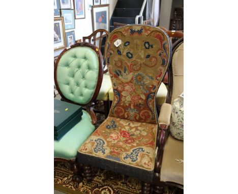 A Victorian mahogany framed spoon back low chair with embroidered tapestry seat and back, on barley twist splay supports 