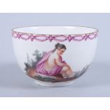 An 18th century German porcelain cabinet cup, decorated bathing maiden (chip to foot rim)