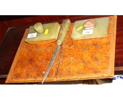 A leather desk blotter and onyx desk set, and a brass standard lamp with onyx centre tray 