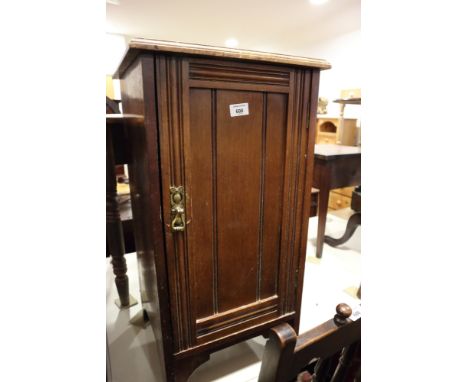 A walnut bedside cupboard enclosed panel door, on bracket feet, 16" wide 