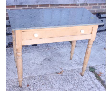 A pine side table with green marble top, on turned supports, 34" wide, and a set of five painted pine ladder back chairs with