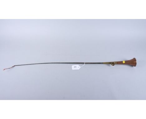 A mid 20th century copper horn/whip, a leather mounted tape measure and a set of stencils 