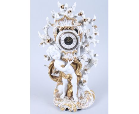 A Capodimonte gilt decorated porcelain mantel clock with putto support, 15" high 