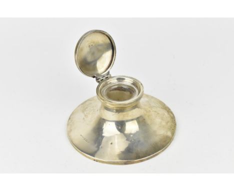 A George V silver capstan inkwell by S Blanckensee & Sons Ltd, Birmingham 1930, of spreading circular shape with hinged lid a