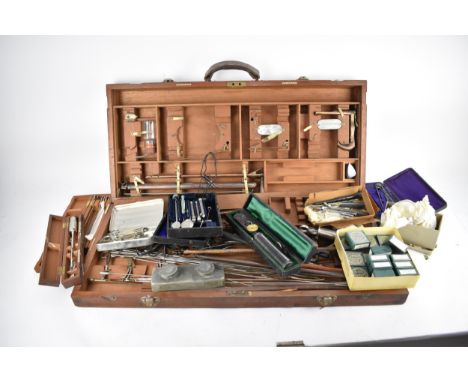 A 20th century cased medical equipment by Down Bros, Opposite Guy's Hospital, with forcep ends, genital catheters, and variou