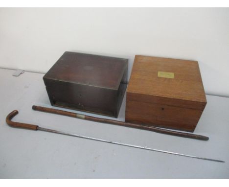 An early 20th century sword stick together with two boxes to include an oak Gerrard boxLocation: 