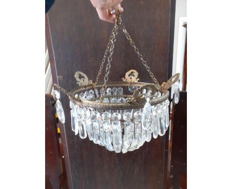 An early 20th century bag light with glass droplets on a brass frame. Location:RAB 