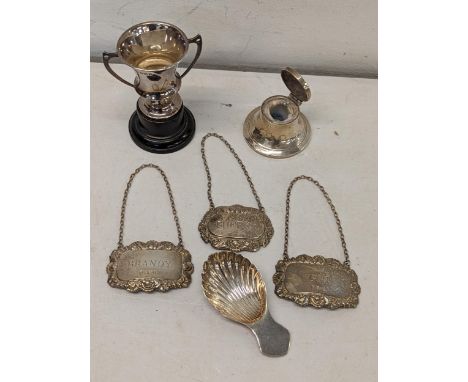 Mixed silver to include decanter labels, trophy, tea caddy spoon and an inkwellLocation: cab 