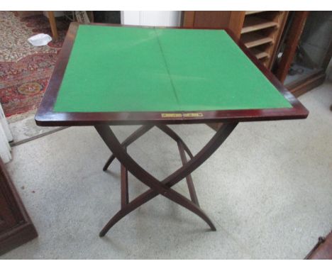 An early 20th century mahogany folding card table having a green bike, 70h x 66w 