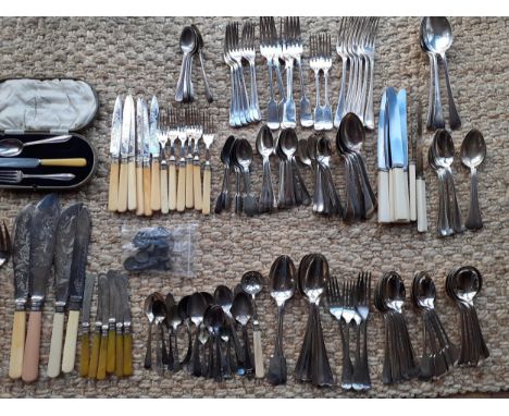 A quantity of mainly mid 20th Century cutlery and flatware to include silver plate and rat tail spoons together with scales w