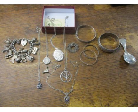 Silver to include a tea caddy spoon, four bracelets, a charm bracelet, brooches and other items Location: Porters 