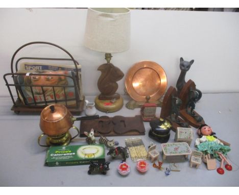 A mixed lot to include a carved wooden squirrel table lamp, folding book slide, brass and wood magazine/paper rack, Pelham Pu