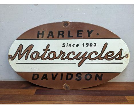 A reproduction enamel advertising sign, Harley Davidson Motorcycles Since 1903 in brown, white and black, 61cm x 31.5cm