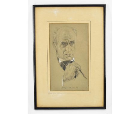 Philip Youngman Carter (1904-1969) Britishdepicting a portrait of the actor Alistair Sim holding a dip pen in a thinking pose