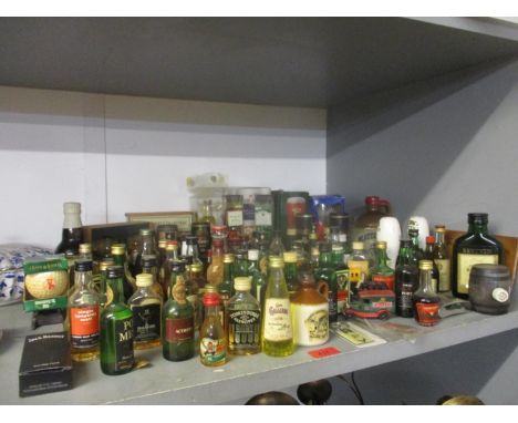 A collection of miniatures, along with beer glasses and other brewing related items to include various scotch whisky miniatur