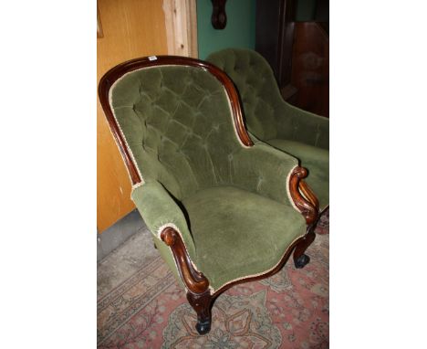 A Victorian Mahogany show frame salon Armchair having exposed hoop back with button upholstery in green velvet, and Scroll en
