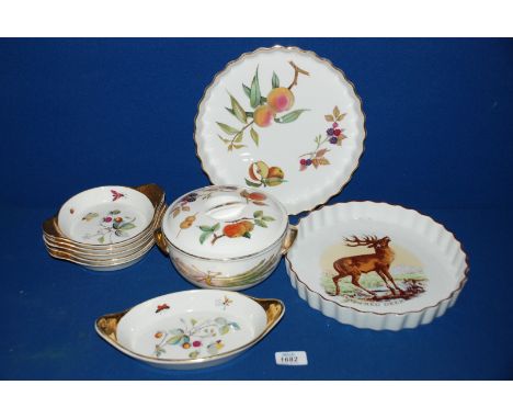 A quantity of Royal Worcester china including 'Evesham' flan Dish, an 'Old English Game' flan Dish, etc.