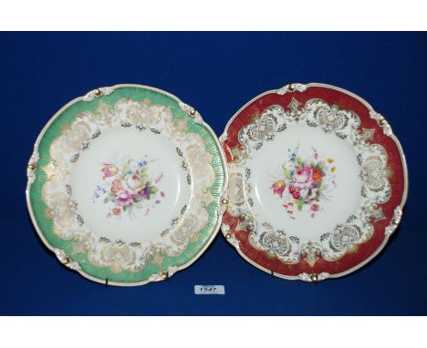 A pair of Royal Crown Derby Plates, one in red and gilt, the other green and gilt, both with floral detail to the centres and