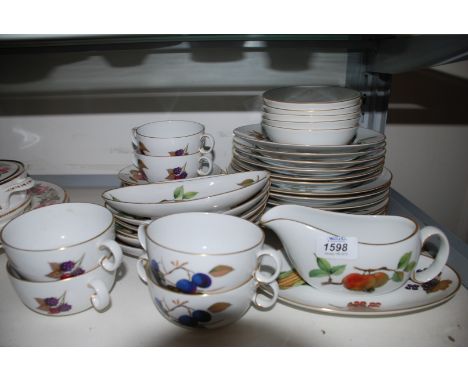 A Royal Worcester ''Evesham'' part Dinner set including six boat shaped dishes, gravy boat on stand, six soup bowls on stands