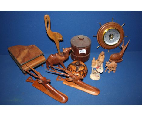 A quantity of treen including ship's wheel Barometer, stags, etc.